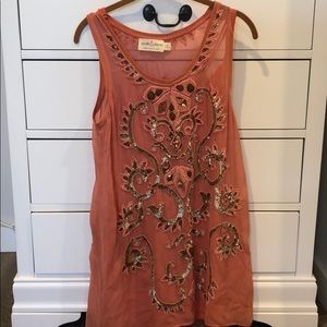 Needle and thread beaded dress.